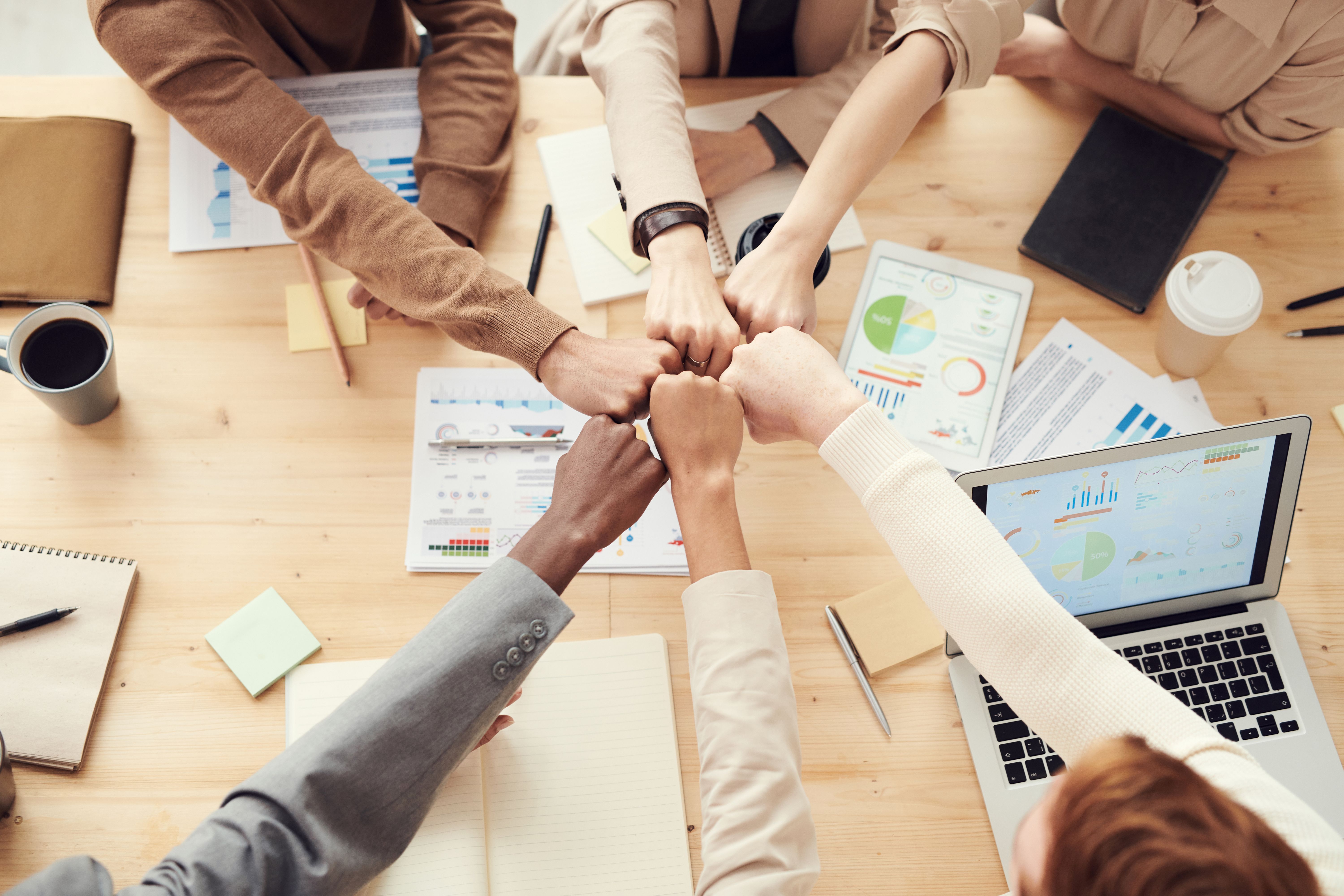Team members collaborating around a table